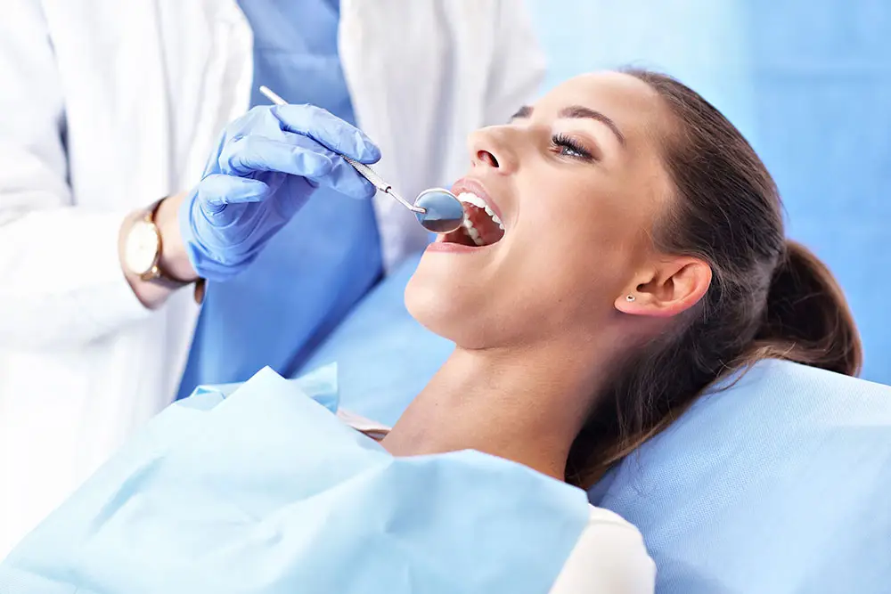 Lady getting teeth examined